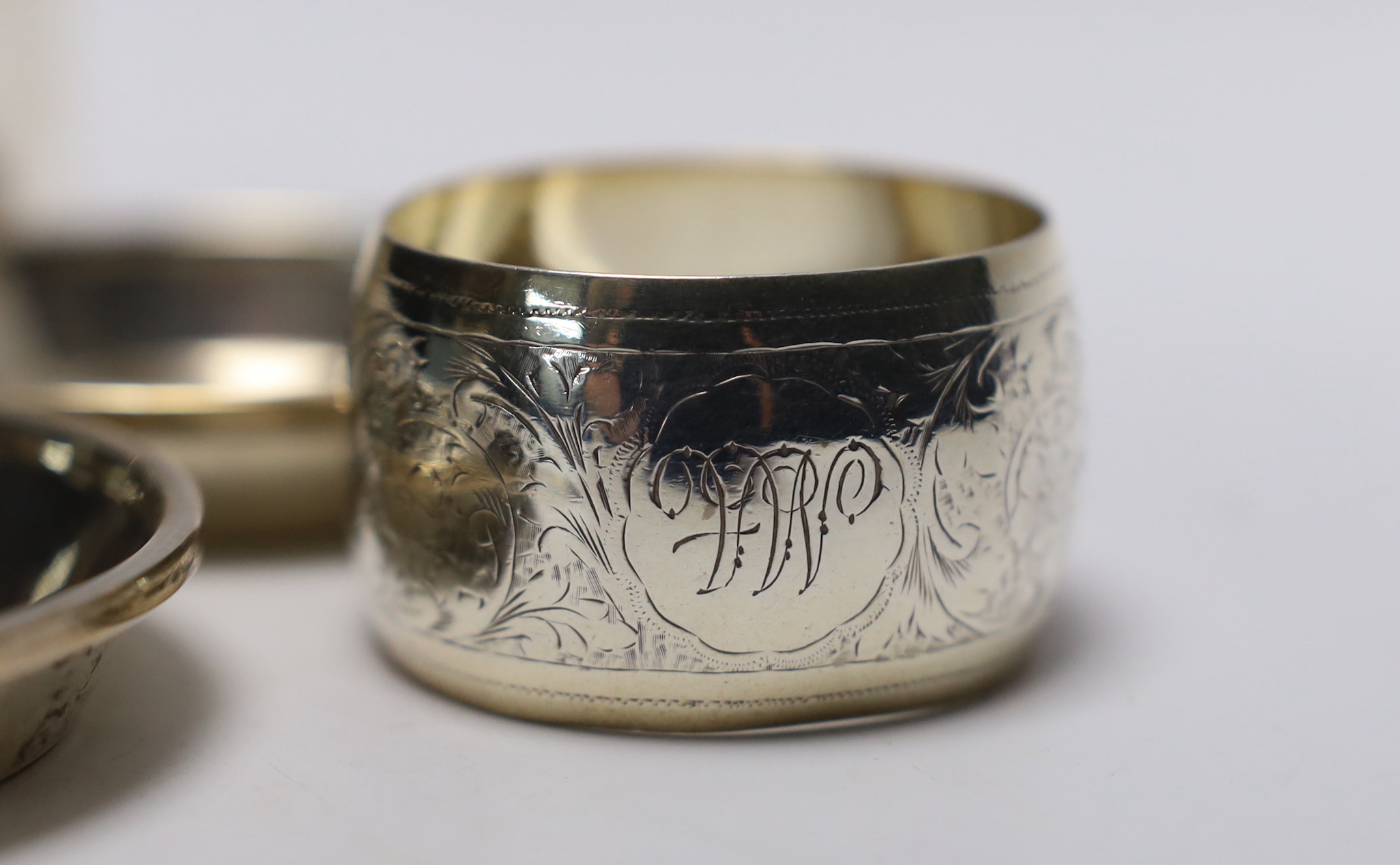 A Victorian silver mustard pot, Martin, Hall & Co, Sheffield, 1885, a set of four small silver dishes by Walker & Hall, a silver spoon & pusher and a silver napkin ring.